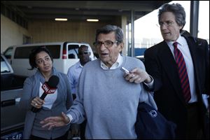 associated pressPenn State football coach Joe Paterno leaves a campus building. A poll Tuesday found mixed support for him.