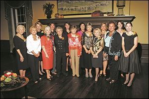 Past and present leaders of the Toledo Hospital Auxiliary gather at the 90th anniversary celebration at Inverness Club.