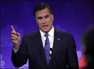 Republican presidential candidate former Massachusetts Gov. Mitt Romney speaks Wednesday during a Republican presidential debate at Oakland University in Auburn Hills, Mich.