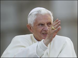 Pope Benedict XVI delivers his blessing Wednesday as he arrives at a general audience he held in St. Peter's square at the Vatican.