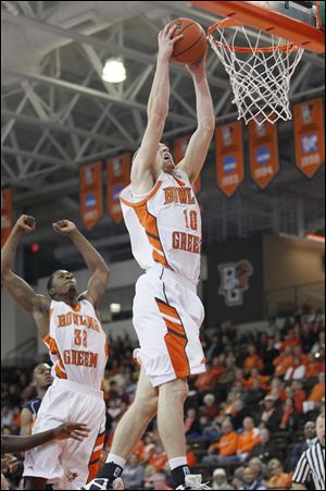 Bowling Green State University player Scott Thomas, 10, dunks during the first half against Howard University at Stroh Center.