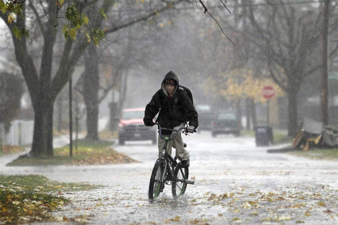 wheeler-riding-bike-rain