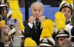 Surrounded by the Euclid High School marching band, Vice President Joe Biden gives a whistle. Mr. Biden stopped at a fire station in Euclid Tuesday in what was billed as the kickoff to the 2012 campaign.