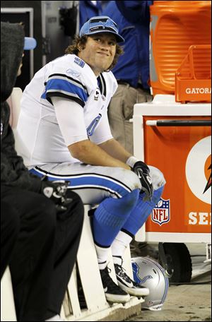 Detroit Lions quarterback Matthew Stafford (9) sits on the bench near the end of the Lions' 37-13 loss to the Chicago Bears in an NFL football game in Chicago.