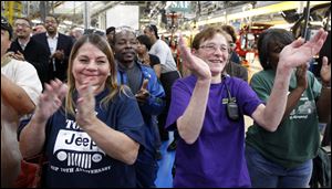 Among Jeep workers cheering at the announcement were Beverly Marsh, left, and Teresa Hoffman. The Chrysler CEO expressed his faith in the work force at the Toledo complex.