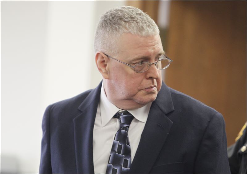 Mark Langlois gets up to leave the courtroom during a lunch break at ...