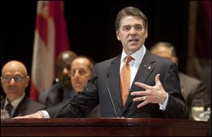 Republican presidential candidate Texas Gov. Rick Perry speaks to a gathering of law enforcement officials in New York. 