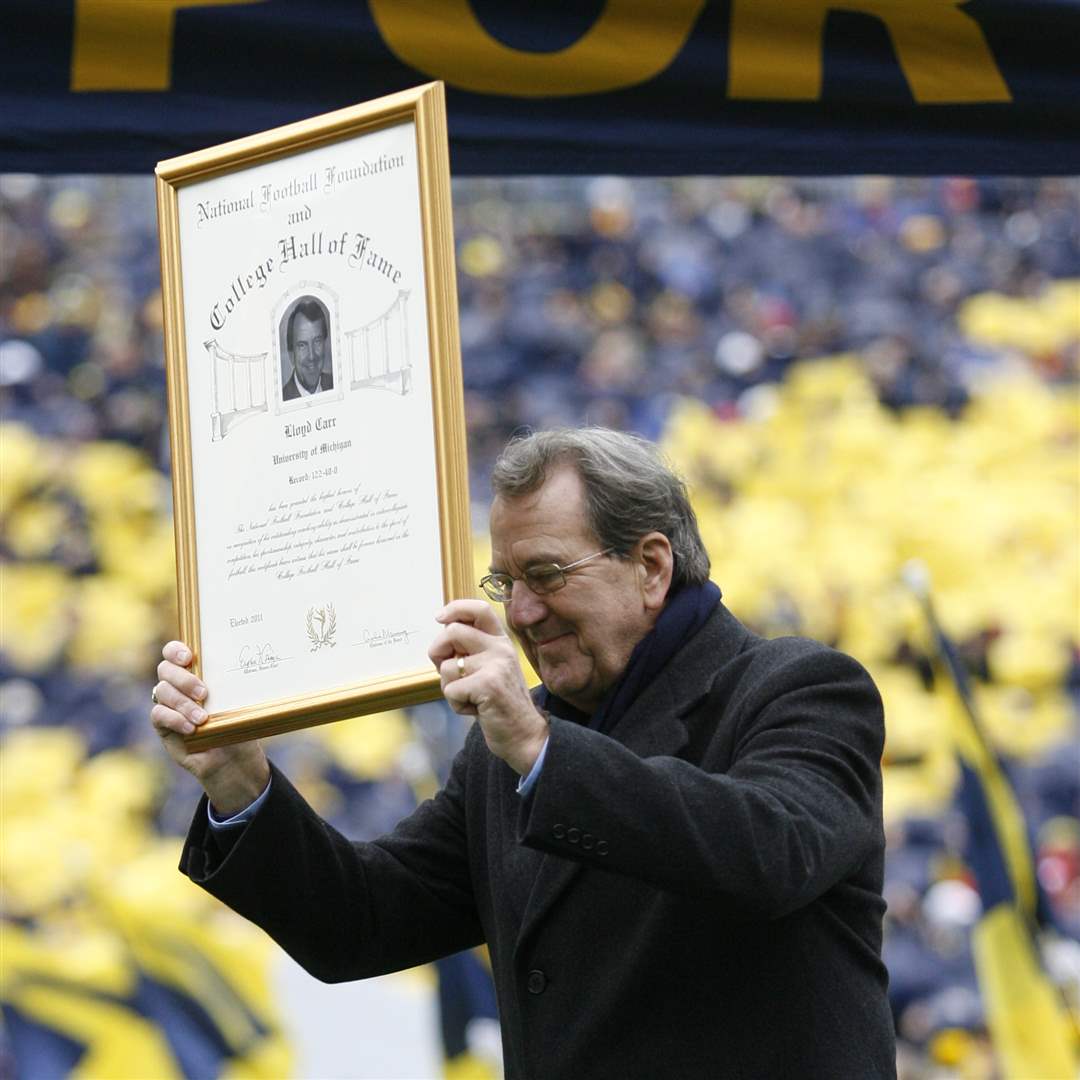 UM-head-coach-Lloyd-Carr-is-honored-before-the-Wolverines-play