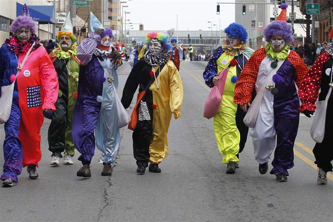 Clowns-from-the-Distinguished-Clown-Corps-march-down-Summit-St