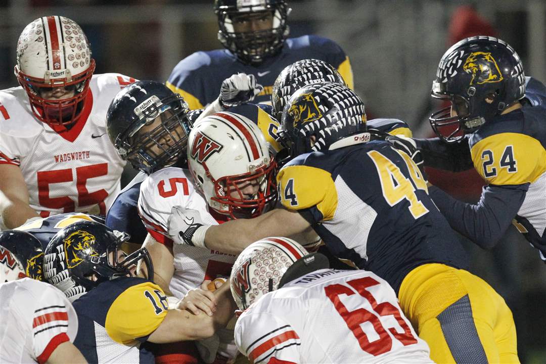 Wadsworth-s-Jack-Snowball-5-is-smothered-by-the-Whitmer-defense