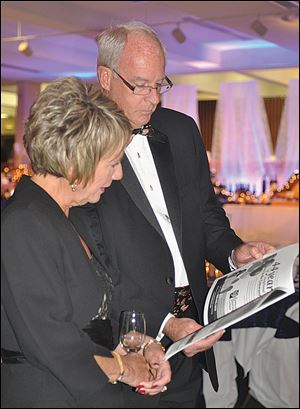 Jerry and Joyce Johnson look over the event program.