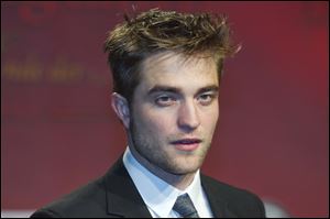 Actor Robert Pattinson arrives Friday at a film premiere of 'Twilight Breaking Dawn Part 1' in Berlin, Germany.