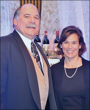 Dan Wakeman, left, CEO of ProMedica St. Luke's Hospital, serves as honorary chair of the Mobile Meals Wine Gala 2011 while Cindy Smith, right, served as chairman.