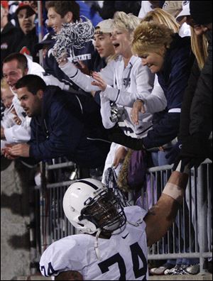 Penn State fans celebrate after defeating Ohio State. Animosity toward Penn State was virtually absent outside Ohio Stadium on Saturday after pleas from the school to maintain respectful behavior.