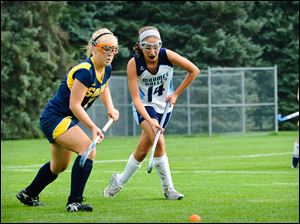 Maumee Valley's Audrey White (14) vies for the ball against a player from Saline, Mich. White, a junior, was the Hawks second leading scorer.