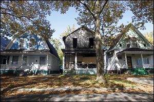 A burned out house is still standing on Fernwood Ave. Many of the homes on the 1100th block are either burned out or boarded up.