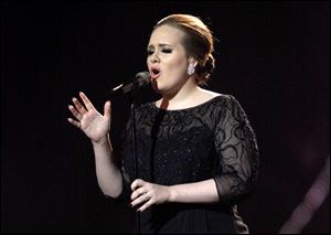 Adele performs during the Brit Awards 2011 at The O2 Arena in London. 