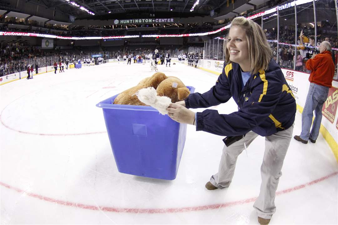 Walleye-promotions-coordinator-Krysten-Kachmarik-picks-up-stuffed-animals