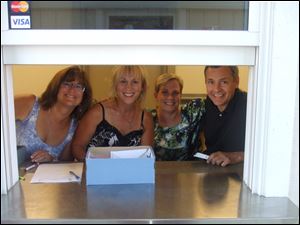 Kathy Bules, Mary Kay Urbanski & John & Sue Philipot work the ticket window at Fashionably Late, the second annual community event Aug. 26 at Centennial Terrace in Sylvania.