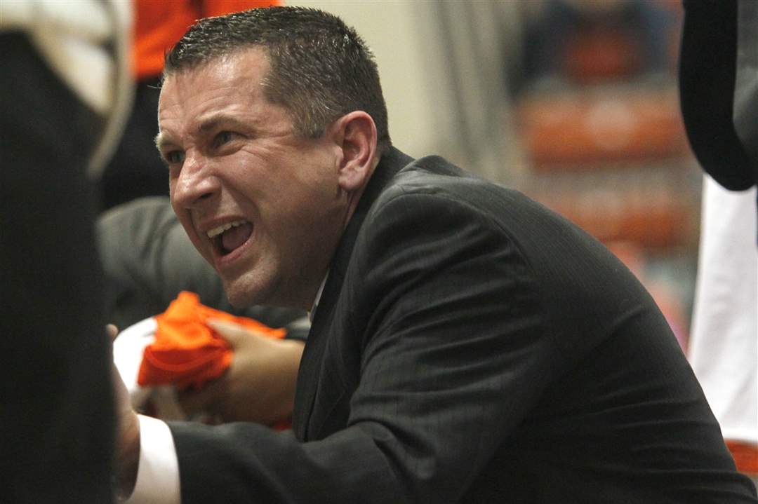 BGSU-coach-Curt-Miller-during-a-timout-speaks-to-his-team