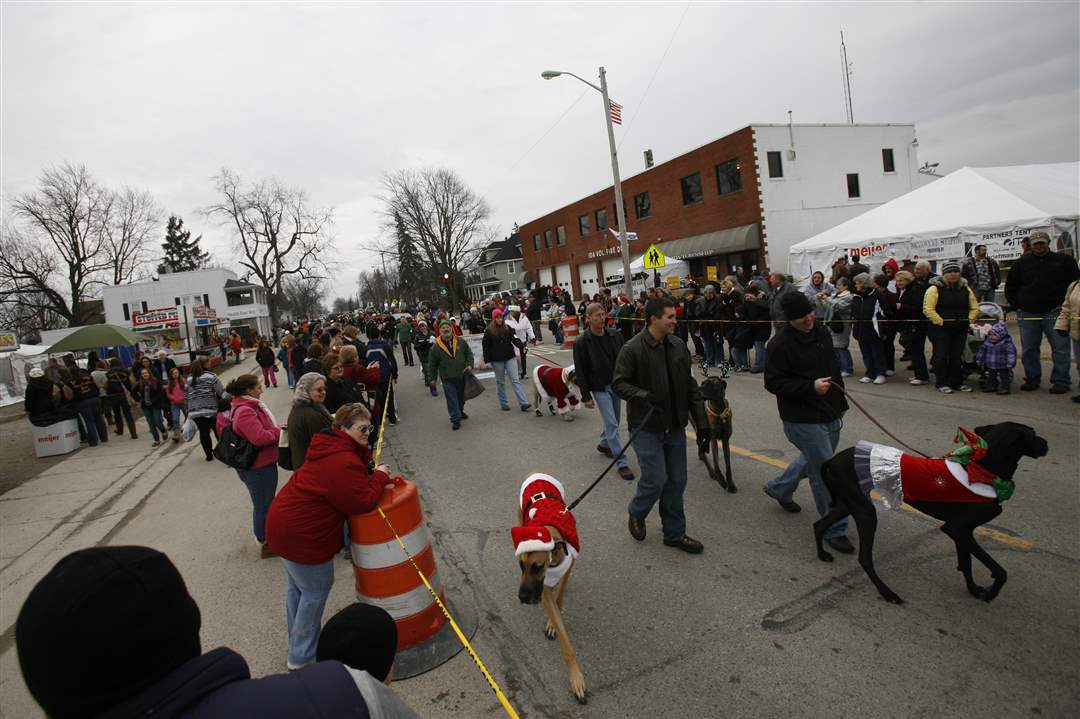Participants-march-through-downtown-during-Holiday-Hounds-on-Parade