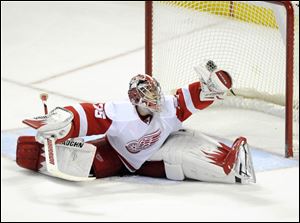 Detroit Red Wings' Jimmy Howard (35) makes a save against the Buffalo Sabres during the third period of an NHL hockey game in Buffalo, N.Y., Friday.
