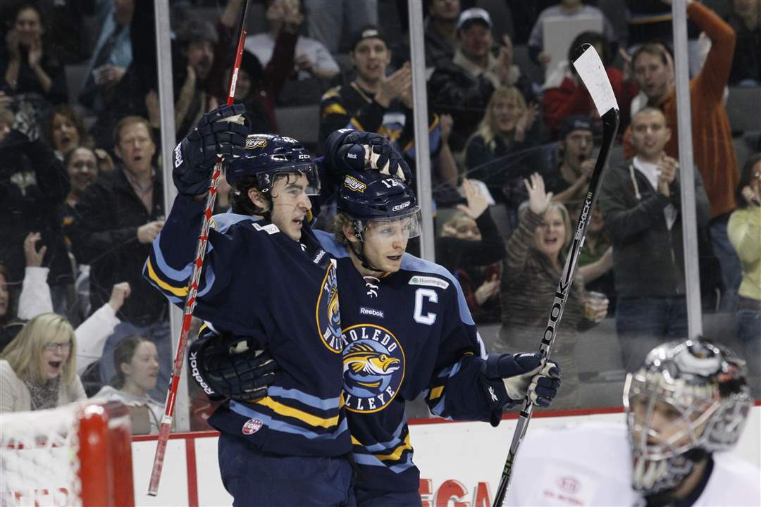 Toledo-Walleye-players-Trevor-Parkes-left-and-Kyle-Rogers-celebrate-a-goal