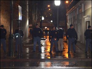 Police clear out the Bowling Green Community Commons area early Monday morning.
