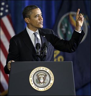 President Obama addresses gestures while speaking at Osawatomie High School in Osawatomie, Kansas, Tuesday.
