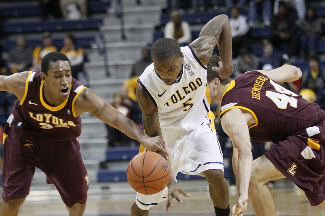 UT-player-Pearson-is-fouled-by-Loyola-Chicago-s-Christian-Thomas