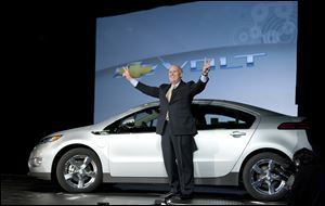 Daniel F. Akerson stands near a Chevy Volt in Detroit. Since taking over GM in 2010, Mr. Akerson has  led the firm through turbulence, but he faces challenges ahead.