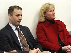 Tony Packo III, left, and Cathleen Dooley, right, sit in the courtroom during the Tony Packo's hearing on Jan. 4.