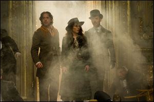 Robert Downey Jr., Noomi Rapace, and Jude Law star in 'Sherlock Holmes: A Game of Shadows.'