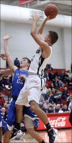 Lake's Josh Tantari shoots a basket over Elmwood defender Aaron Arnold. Tantari finished with 24 points for the undefeated Flyers.