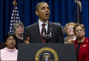 President Barack Obama speaks Thursday in the Eisenhower Executive Office Building on the White House campus in Washington, where he announced action to provide minimum wage and overtime protections for in-home care workers. 