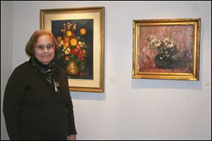 Susan Talbot-Stanaway, director of Zanesville Museum of Art , showcases artwork by Karl Kappes. 