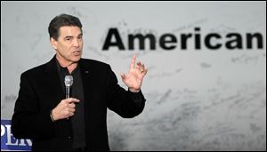 Republican presidential candidate Texas Gov. Rick Perry speaks to workers and local residents Thursday after touring the TPI Iowa wind blade manufacturing facility in Newton, Iowa.