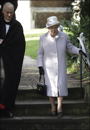Britain's Queen Elizabeth II, right, leaves after she and other members of the royal family attended a Christmas Service at St. Mary's church. Her husband Prince Phillip was absent after he was admitted to a hospital for surgery earlier this weekend.