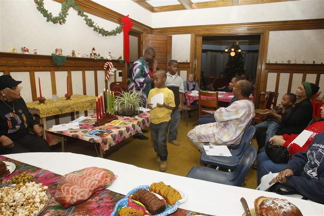 Children-file-back-to-their-seats-after-reading-aloud-descriptions-of-the-seven-principles-of-Kwanzaa