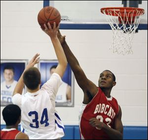 Bowling Green’s Vitto Brown defends against Anthony Wayne’s Mark Donnal. Brown helped the Bobcats win an NLL title last year