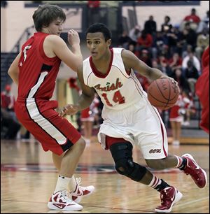 Central Catholic’s DeShone Kizer drives against Bedford’s Brendan Renius. Kizer has helped the Irish to start the season 4-1.