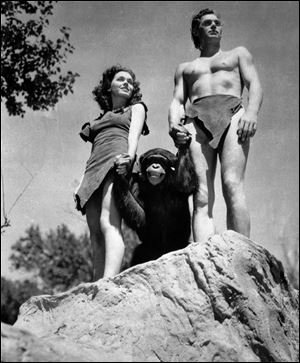 A file photo shows Johnny Weissmuller, right, as Tarzan, Maureen O'Sullivan as Jane, and Cheetah the chimpanzee, in a scene from the 1932 movie 