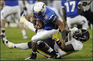 Toledo defensive lineman Malcolm Riley sacks Air Force quarter quarterback Tim Jefferson.