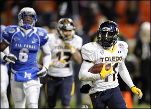 Rockets wide receiver Bernard Reedy, who was named the most valuable player of the Military Bowl, runs toward the end zone in the third quarter to score his third touchdown. 