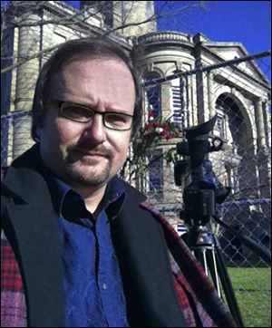 'To me, at this point, we need to try to show why this happened and if there's anything somebody can learn from it,' says documentary filmmaker John Ondo, in front of the county courthouse in Tiffin.