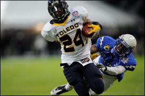 Toledo running back Adonis Thomas runs for a TD during the Military Bowl. It was UT's first bowl win since the 2005 GMAC Bowl.