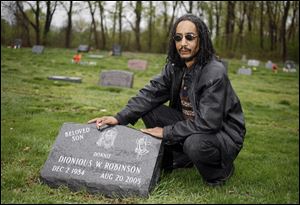 Leslie Robinson has been a frequent visitor to the grave of his son Dionious 'Donnie' Robinson, in Forest Cemetery on Mulberry Street. He said Friday that he is glad that the second man sentenced in his son's killing knows Mr. Robinson made sure he went to prison.