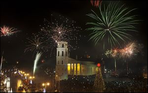 Fireworks light the sky above the Cathedral Square in Vilnius shortly after midnight, greeting the New Year, Sunday. Thousands of people celebrated the beginning of the New Year 2009 in the Lithuanian capital.
