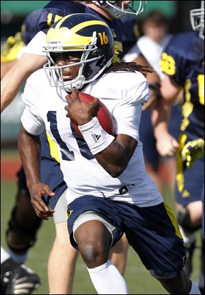 Denard Robinson works out Friday in preparation for Tuesday's Sugar Bowl in New Orleans.