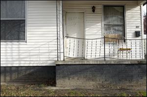 The family of Marquan McCuin, 18, who was killed July 3 in an alley off the 1100 block of Gordon Street, lived in this house.